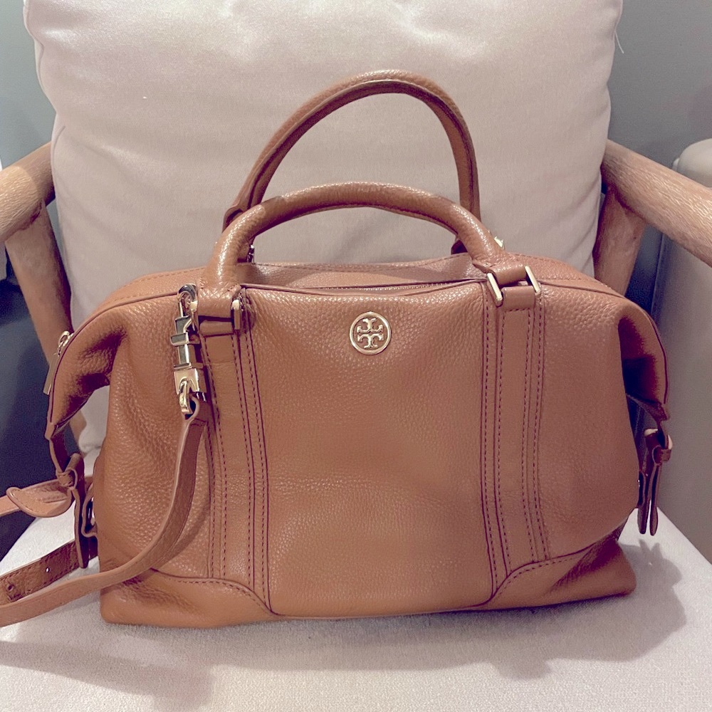 Tory Burch dark tan leather purse with cross body strap.